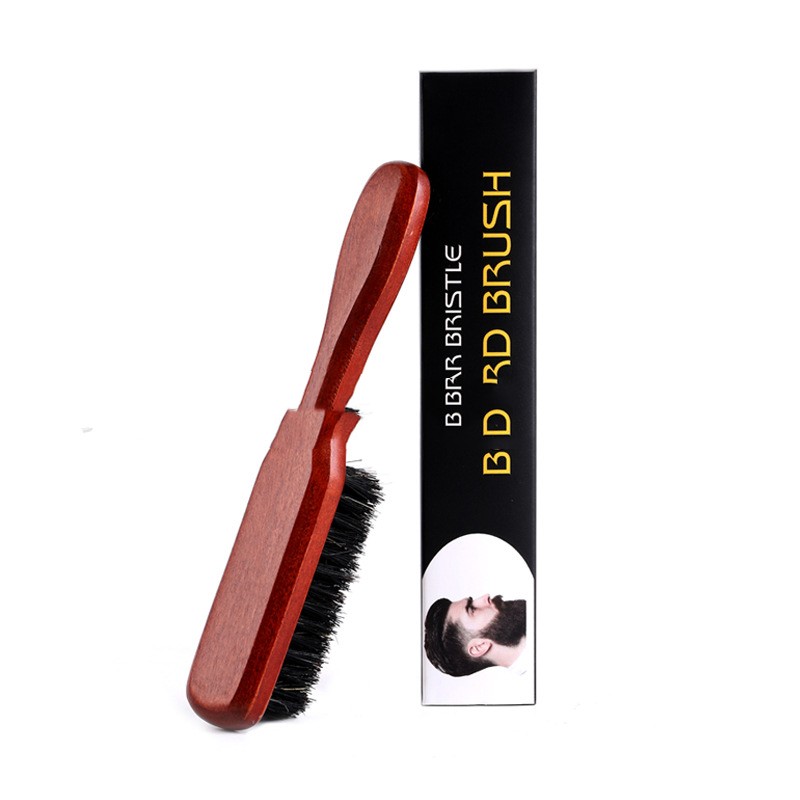 Wooden beard brush with black bristles and packaging on a white background
