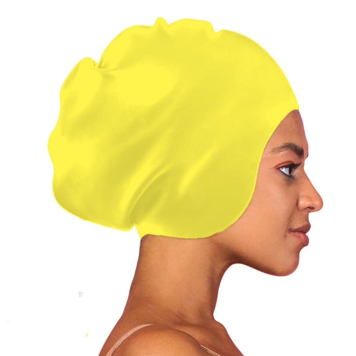 Yellow swim cap worn by a person on a white background