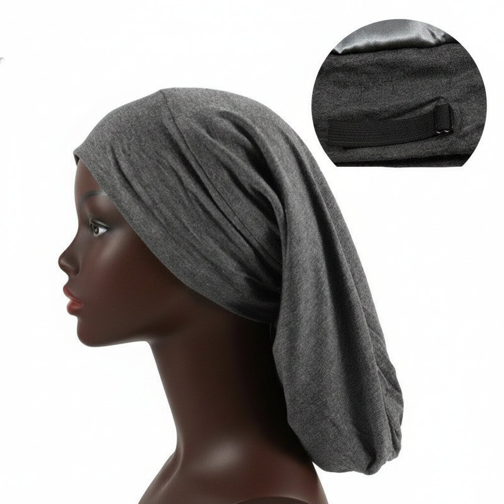 Satin lined long nightcap protecting braids and long hair
Adjustable sleep cap for dreadlocks and thick hairstyles
Woman wearing satin bonnet for frizz-free overnight hair
Long hair nightcap with secure comfortable fit