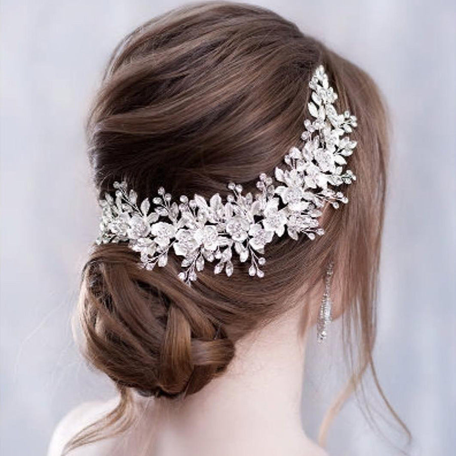 Elegant bridal headband silver crystal wedding hair accessory
Gold wedding headband for bride formal hairstyle accessory
Woman wearing bridal hairband for wedding hairstyle
Alloy headband for special occasions and bridal look