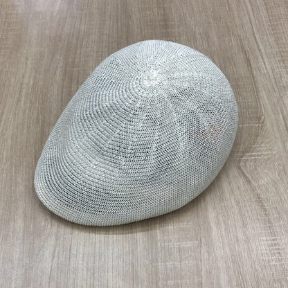Woman wearing hand-painted crochet baseball cap in Korean minimal style outdoors