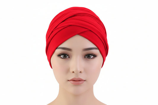 Red headscarf on a mannequin head with a white background
