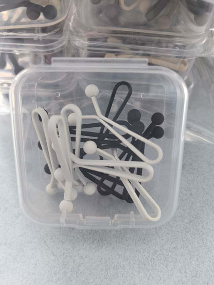 12 matte long scarf clips arranged for hijab styling
Close-up of silicone grip hijab scarf clip holding fabric
Elegant platinum finish scarf clips for headscarves
Lightweight matte hijab clips for daily modest fashion wear
