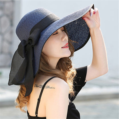 Foldable women's sun hat packed flat, showing travel-friendly flexible brim design