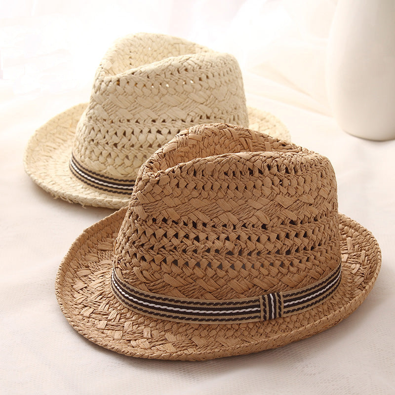 Matching parent and child papyrus straw wide brim sun hats on white background