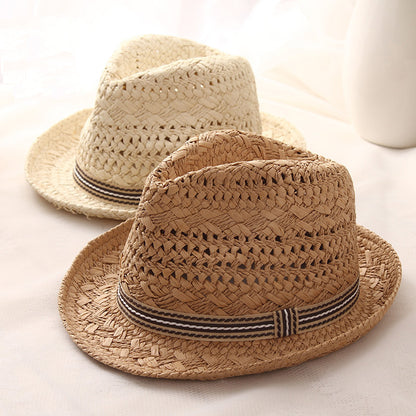 Matching parent and child papyrus straw wide brim sun hats on white background