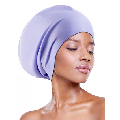 Extra-large waterproof silicone swimming cap designed to fully cover hair and protect ears, featuring a non-squeezing head fit for comfort during swimming