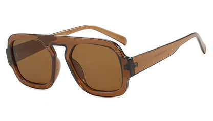 Brown sunglasses with a black frame on a white background 
unisex sunglasses stylish uv protection lightweight frame
modern sunglasses for travel driving outdoor use
sleek fashion sunglasses comfortable secure fit
durable sun glasses unisex casual everyday wear