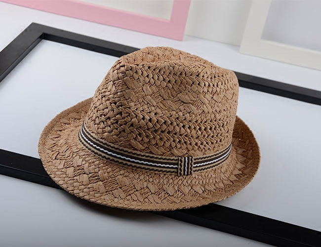 Adult M and child S straw sun hats side by side showing size difference