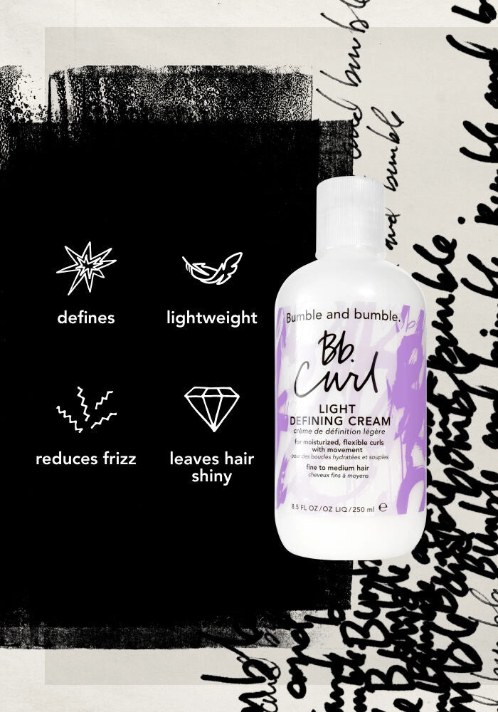 A bottle of Bumble and Bumble Blunt Curl Light Defining Cream is shown against a stylized black and white background with graphic text and icons highlighting product benefits: defines, lightweight, reduces frizz, and leaves hair shiny.