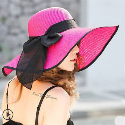 Foldable women's sun hat packed flat, showing travel-friendly flexible brim design