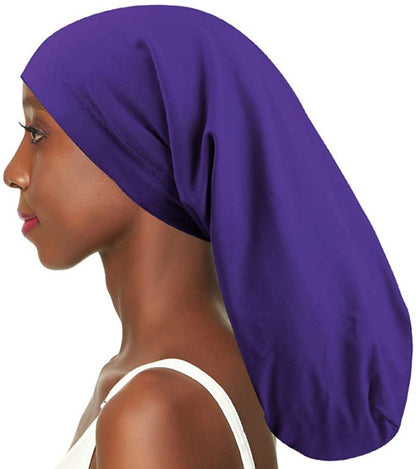 Satin lined long nightcap protecting braids and long hair
Adjustable sleep cap for dreadlocks and thick hairstyles
Woman wearing satin bonnet for frizz-free overnight hair
Long hair nightcap with secure comfortable fit
