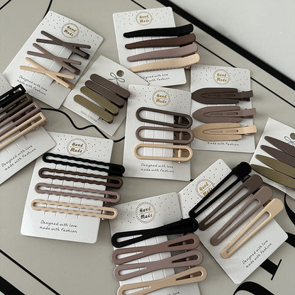 Coffee color alloy hair clips set with irregular modern designs