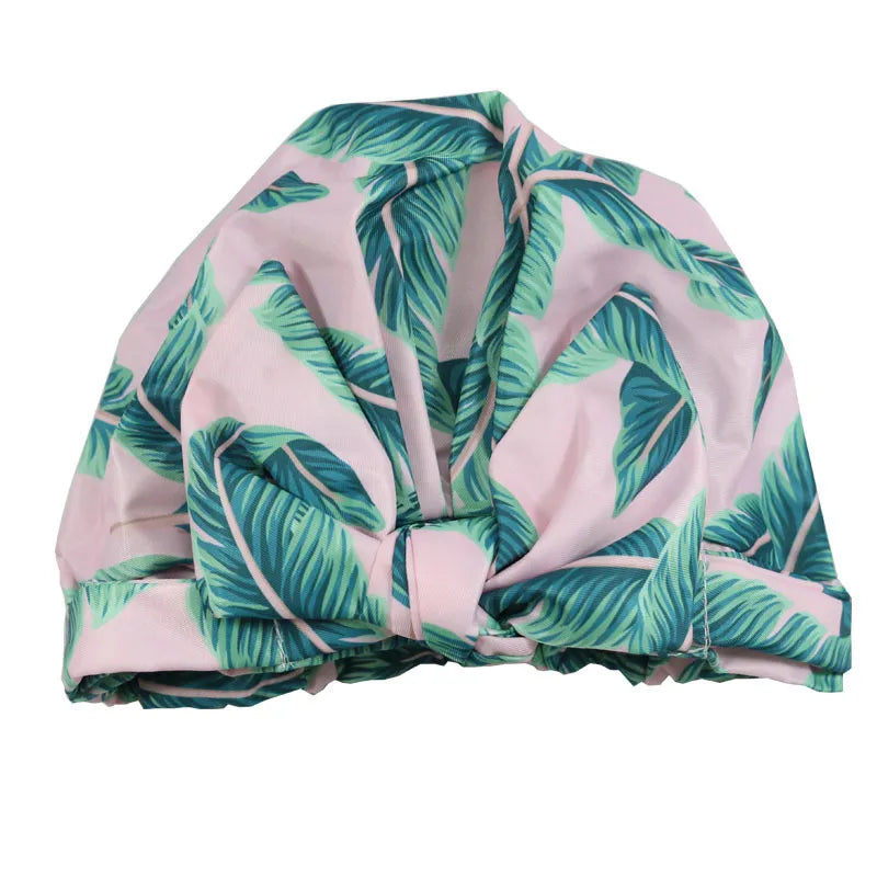 Turban with tropical leaf pattern on a white background