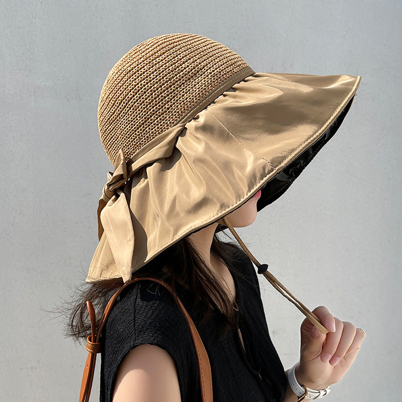 Close-up of satin-finish bow accent on wide brim casual visor cap