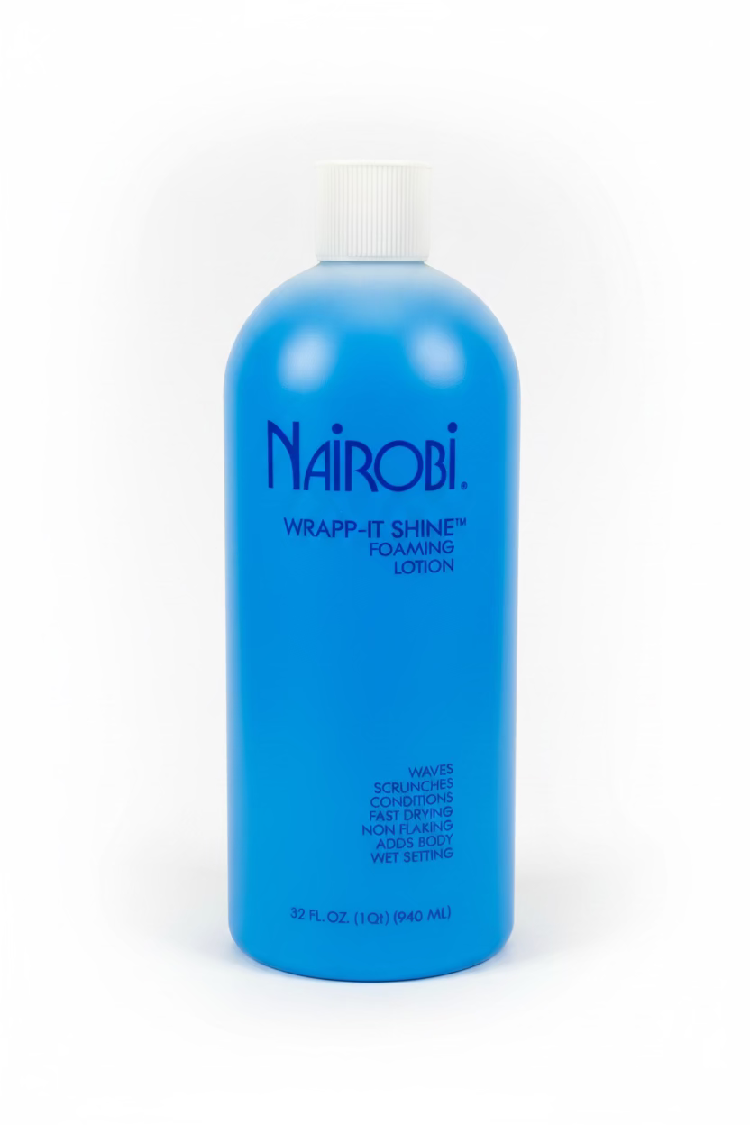 A blue bottle of Nairobi Wrapp-It Shine Foaming Lotion with a white cap, photographed on a white surface with a blurred background.