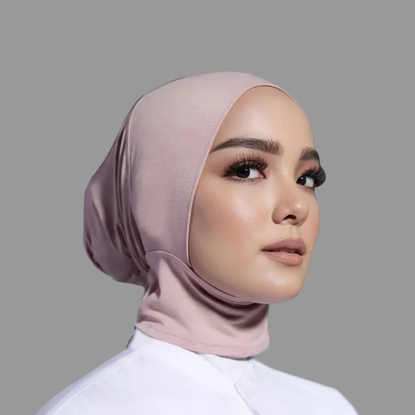 Woman wearing a hijab with color swatches displayed on a white background