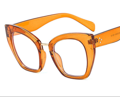 Orange cat-eye glasses with 'TEA+AB LENSES' 