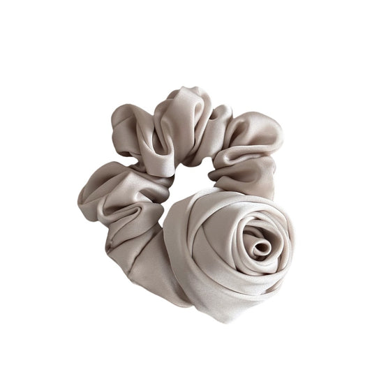 Beige scrunchie on a white background