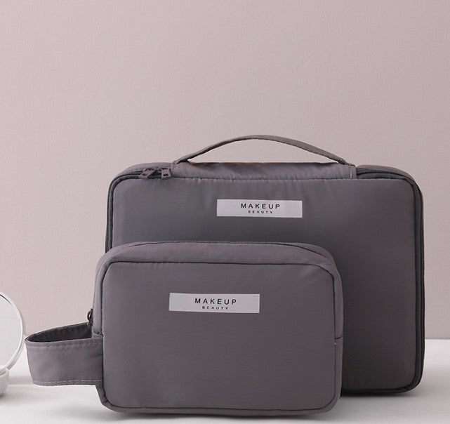 Two gray makeup bags with 'MAKEUP' branding on a light background