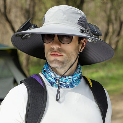 Man wearing a wide-brimmed hat with solar panels outdoors