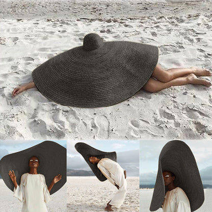  Woman wearing wide-brim white straw hat outdoors, shielding face from sun with flat-eave design