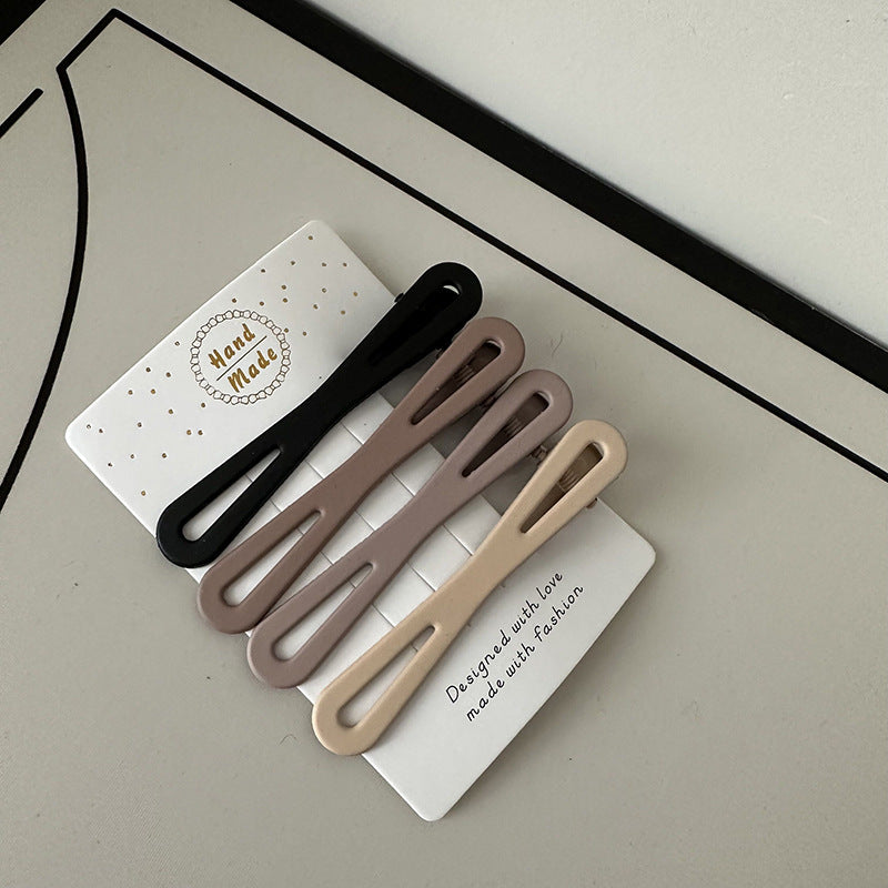 Coffee color alloy hair clips set with irregular modern designs