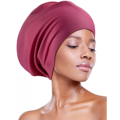 Extra-large waterproof silicone swimming cap designed to fully cover hair and protect ears, featuring a non-squeezing head fit for comfort during swimming