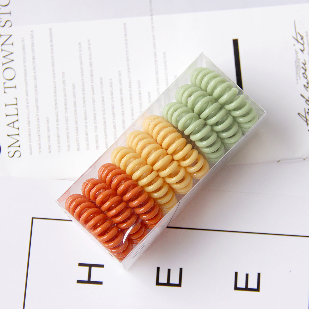 Vintage TPU hair rings no crease ponytail holders multi color
Strong hold hair ties for buns and ponytails flexible design
Geometric hair rings worn as wrist accessory and hair tie
Durable TPU hair bands for thick hair everyday styling
