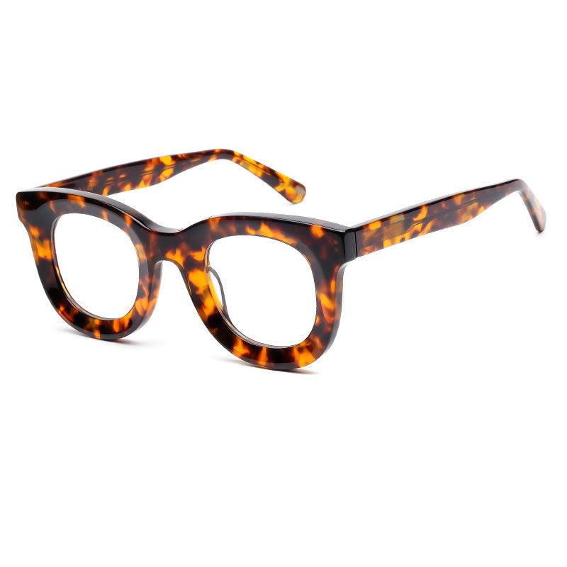 Eyeglasses with orange and black frame on a white background