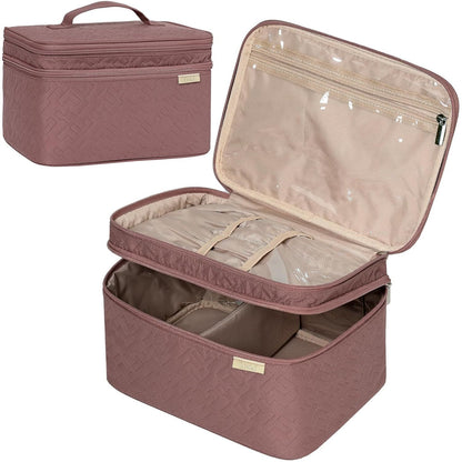 Pink quilted cosmetic case with clear top compartment on a white background