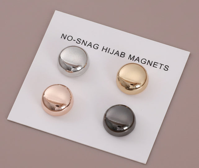 Set of four hijab magnets on a white card with 'No-Snag Hijab Magnets Magnetic hijab pins no snag colorful macaron clasp set
Strong magnetic scarf clips holding hijab without holes
Round colorful hijab magnets for secure fabric hold
Lightweight no snag hijab clasps for everyday wear